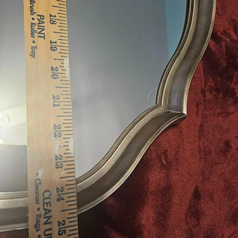 beautiful, scalloped mirror with wire hanger on back